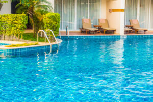 Pool with blue water and chairs